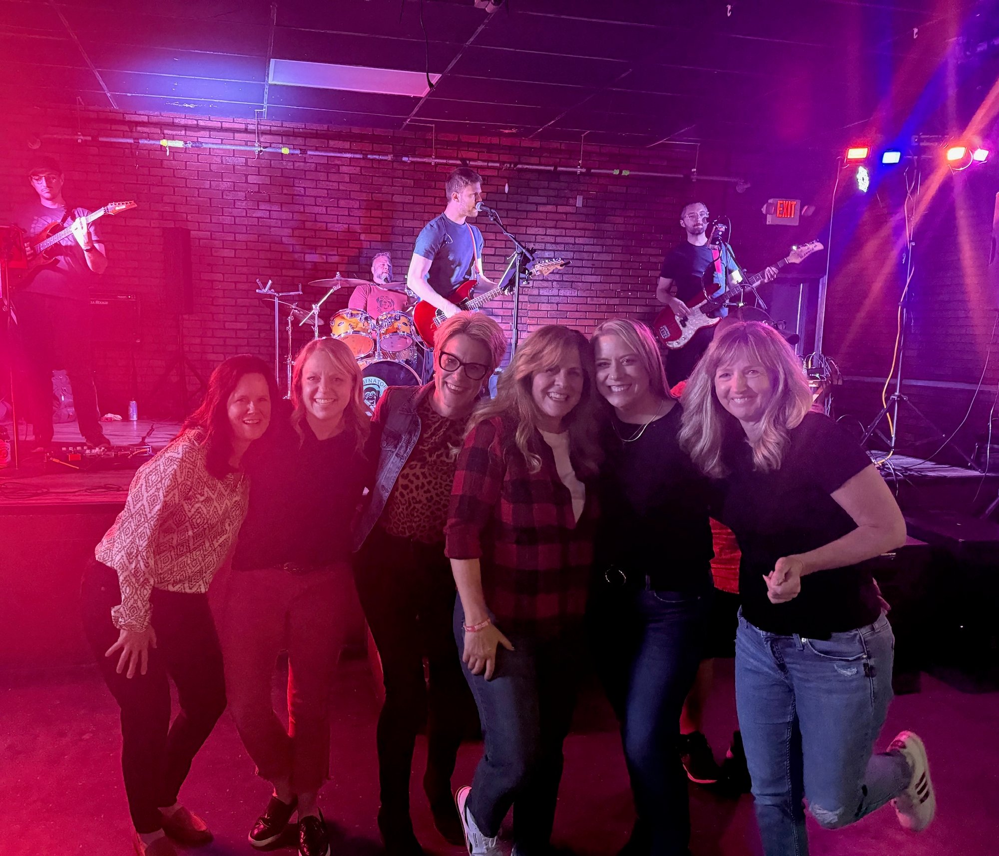 Fans posing in front of Harry Norman Music