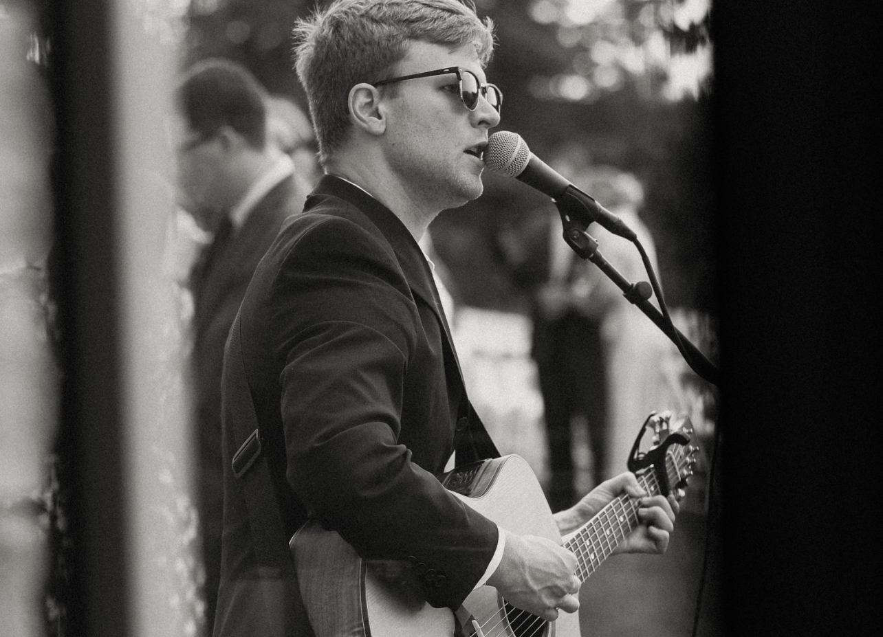 Harry Norman performs for an outdoor wedding